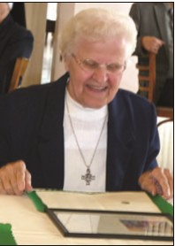 Sister Margaret Kapusnak, OSBM is elated as she reads the Certificate of Appreciation presented to her and also to each of her religious colleagues on behalf of the Byzantine Serra Club. The certificates were awarded in recognition of the years of service dedicated by each honoree.